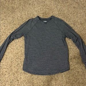 Men's black and white striped shirt.